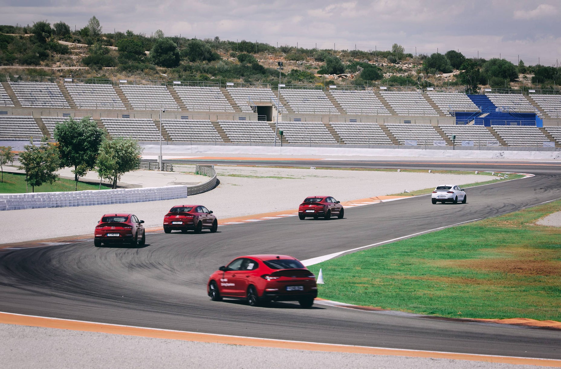 Hyundai cars driving on a race track
