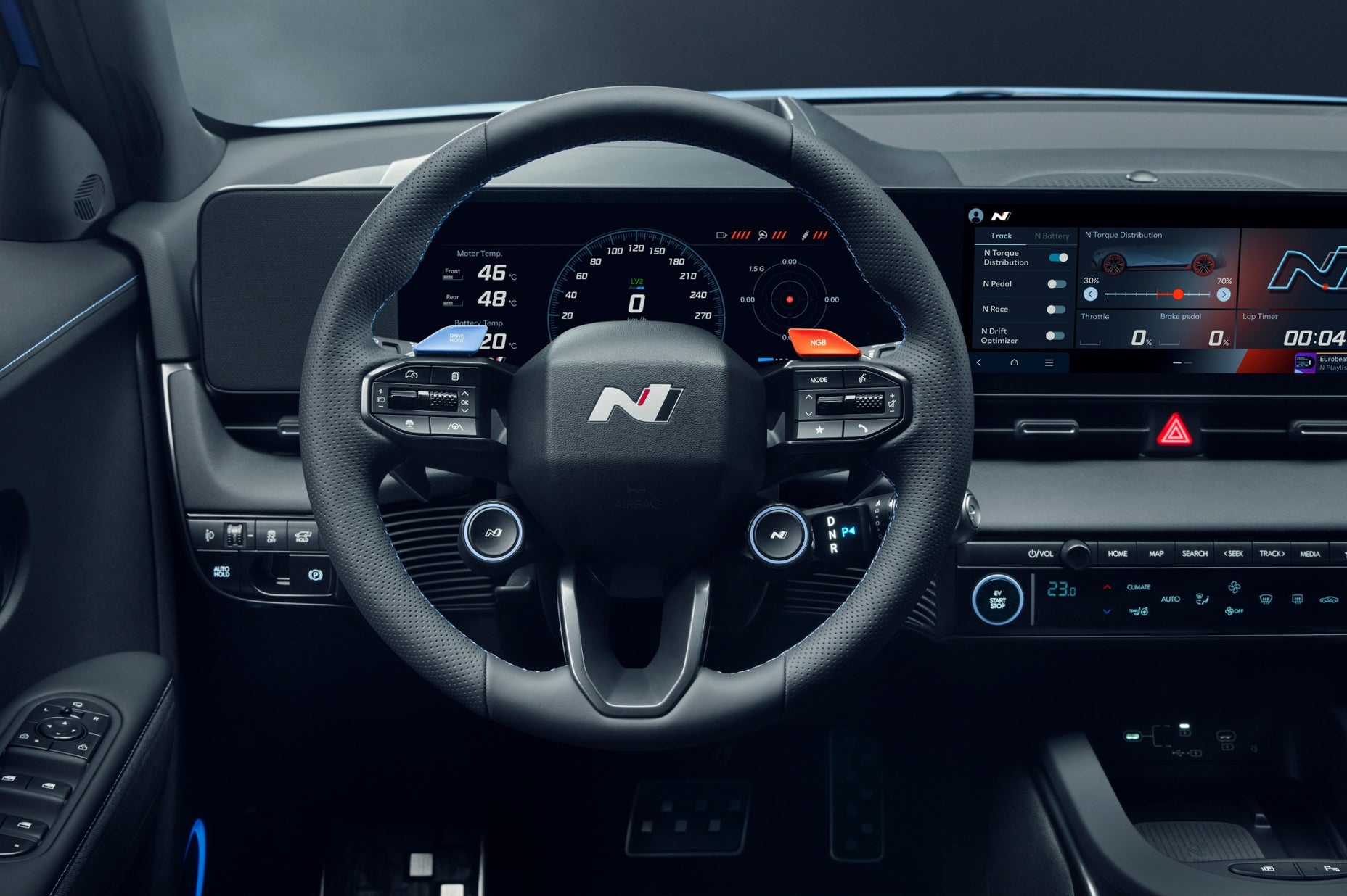 Close-up of the Hyundai IONIQ 5 N steering wheel and digital cockpit, featuring sporty controls, performance-focused displays, and the N logo at the center.
